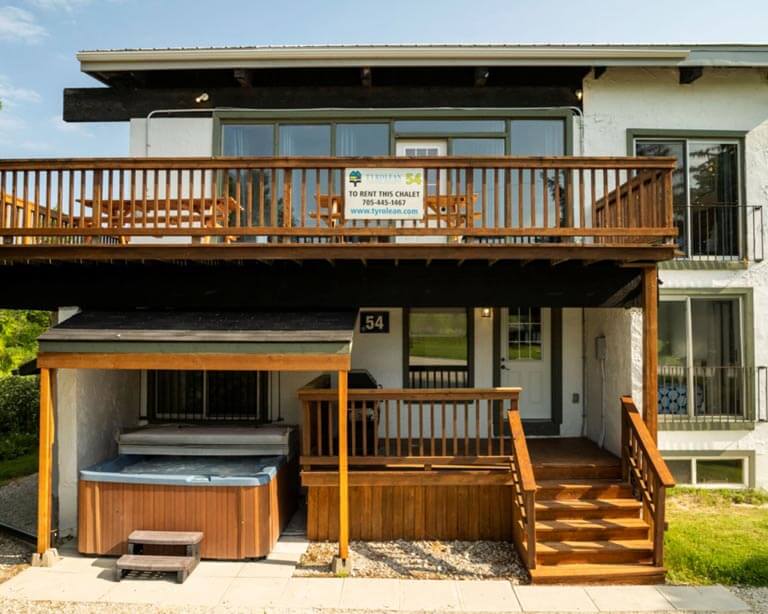 Exterior view of modern cottage with balconies